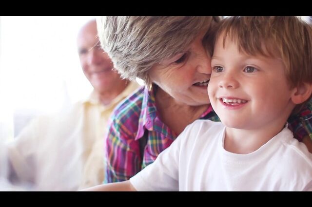 Grandmother holding grandson