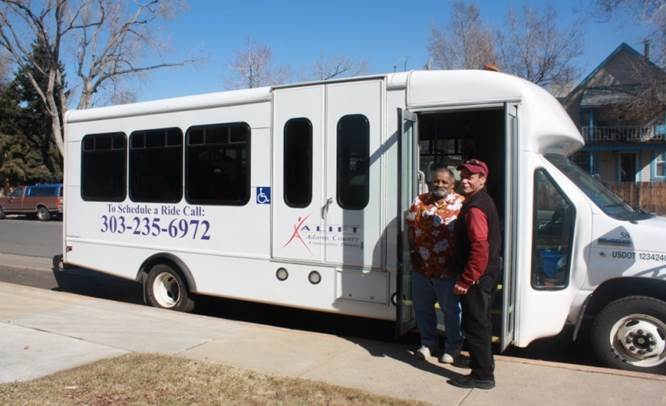 A-LIFT van with two smiling men in front, displaying text: "To Schedule a Ride Call: 303-235-6972" and a logo with a stylized figure.