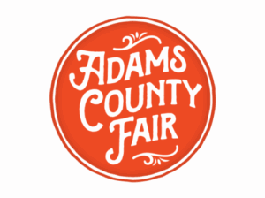 Adams County Fair logo with ornate white lettering on a red circle