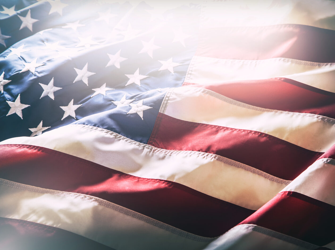 Close-up of a gently waving American flag with stars and stripes