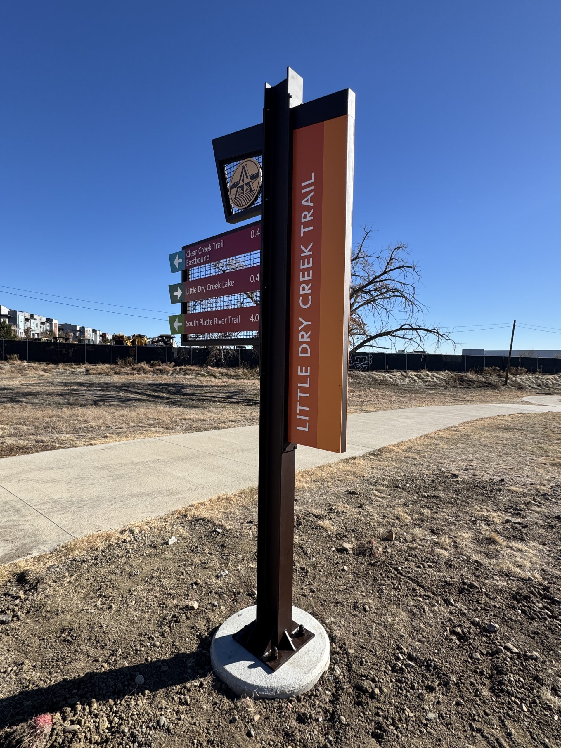 Little Dry Creek Trail sign with directional arrows to trails and lake.