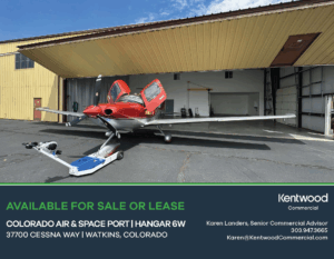 Red airplane at hangar for sale or lease, Kentwood Commercial. Colorado Air & Space Port, Hangar 6W, Watkins, Colorado. Contact Karen Landers, 303.947.3665, Karen@KentwoodCommercial.com