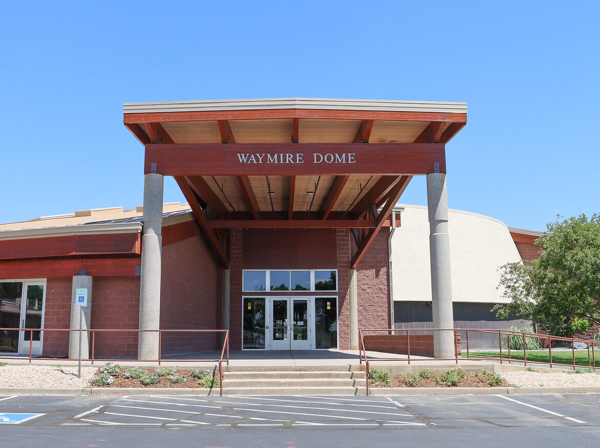 Waymire Dome entrance with accessible parking spaces and modern architecture.