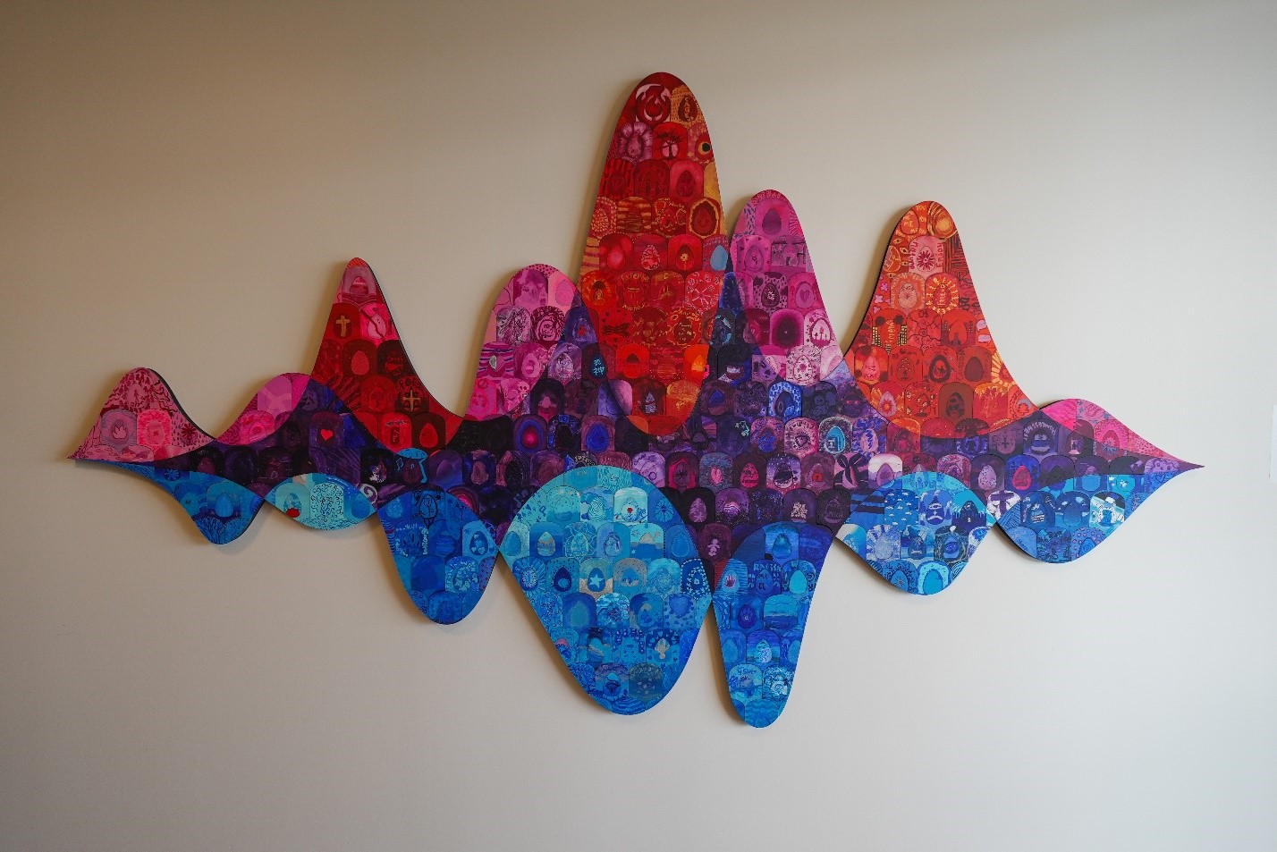 Abstract wall art with colorful wave patterns and intricate designs