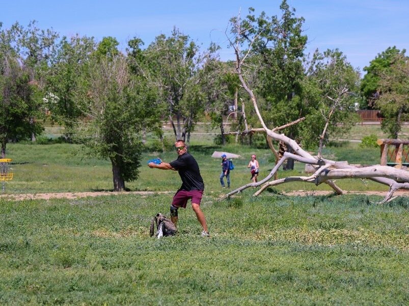 Man in athletic gear throwing frisbee in park, Picture8.jpg