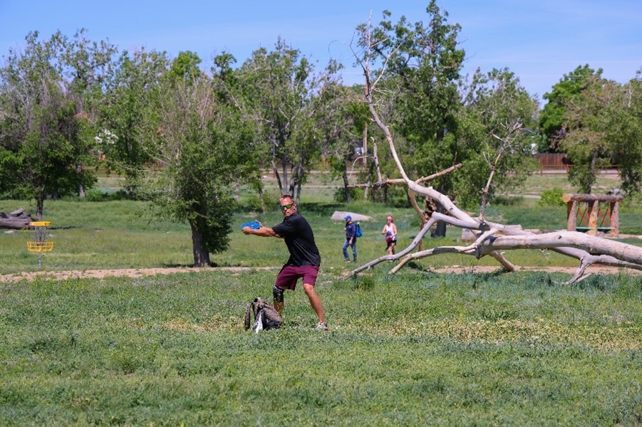 Man in athletic gear throwing frisbee in park, Picture8.jpg