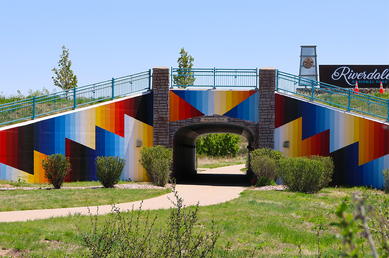 Colorful geometric mural on underpass at Riverdale Regional Park